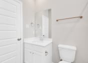 Thumbnail 29 of 39 - a bathroom with a sink toilet and mirror
