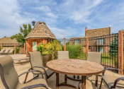 Thumbnail 11 of 12 - Pet-Friendly Apartments in Overland Park– Treetop Lodge –lounge by pool