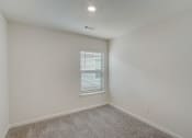 Thumbnail 22 of 46 - an empty room with white walls and a window