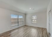Thumbnail 29 of 46 - the living room of an apartment with wood flooring and large windows