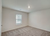 Thumbnail 33 of 46 - an empty room with carpet and a window