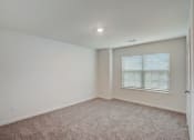 Thumbnail 41 of 46 - an empty room with carpet and a window