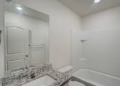 Thumbnail 42 of 46 - a bathroom with a sink and a toilet and a shower