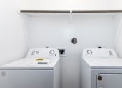 Thumbnail 15 of 39 - a washer and a dryer in a laundry room