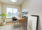 Thumbnail 8 of 15 - a desk with a chair and a lamp in a room with a large window