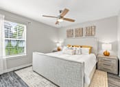 Thumbnail 9 of 28 - Bright primary bedroom at Twin Oaks Apartment Homes near Oak Grove in Hattiesburg