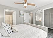 Thumbnail 10 of 28 - Bedroom with adjoining bathroom and spacious closet in a West Hattiesburg apartment