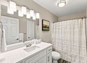 Thumbnail 11 of 28 - Apartment bathroom with vanity and shower-tub combination at Twin Oaks in Hattiesburg