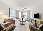 Thumbnail 6 of 28 - Spacious furnished living room at Twin Oaks apartments in West Hattiesburg, MS
