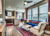 Thumbnail 1 of 18 - Grand Prairie TX Apartments - Living Room Area With Hardwood Style Floors, Chic Decor and Access to Kitchen & Dining Areas