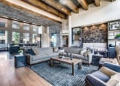Thumbnail 16 of 18 - a large living room with couches and a coffee table