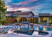 Thumbnail 18 of 18 - Apartments In Grand Prairie, TX For Rent - Waters Edge At Mansfield -Large Sparkling Pool Surrounded By Poolside Lounge Chairs