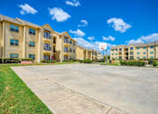 Thumbnail 20 of 22 - Exterior photo of Oak hollow with a basketball court