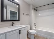 Thumbnail 26 of 42 - a bathroom with a sink toilet and bathtub