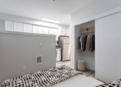 Thumbnail 17 of 42 - a bedroom with a bed and a closet