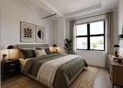 Thumbnail 5 of 25 - A bedroom with a bed, nightstands, and a window.