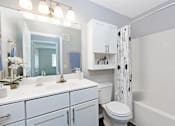 Thumbnail 7 of 19 - Hinton Height_Cottage Grove_MN_a white bathroom with a shower and a toilet