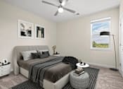 Thumbnail 7 of 21 - Bright spacious bedroom at Hawks Landing Apartments in Hickory, NC with modern furnishings and ceiling fan