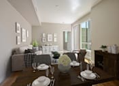 Thumbnail 9 of 18 - A dining room with a table set for a meal.