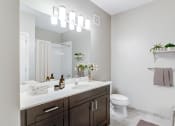 Thumbnail 7 of 20 - bathroom with dark wood vanity