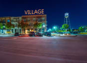 Thumbnail 28 of 40 - Photo of outside of Village of Rowletts building showing Village sign lit up.