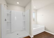 Thumbnail 18 of 30 - a white bathroom with a tub and shower and a closet