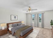 Thumbnail 21 of 63 - A bedroom with a large bed and a ceiling fan.
