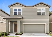 Thumbnail 6 of 38 - A modern house with a garage door and a brown door.