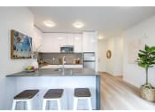 Thumbnail 11 of 54 - Kitchen peninsula with seating