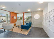 Thumbnail 48 of 54 - Apartments in Seattle, WA - Inspire Fremont - Lobby with Mail Slots, Floor-to-Ceiling Windows, and a Seating Area