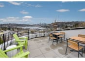 Thumbnail 51 of 54 - Freemont Apartments for Rent-Inspire Fremont-Roof Terrance with Lounge Seating, Tables, and an Amazing View