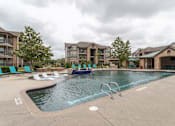 Thumbnail 26 of 33 - swimming pool surrounded by beach chairs