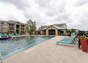 Thumbnail 28 of 33 - swimming pool surrounded by beach chairs