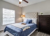 Thumbnail 6 of 33 - a bedroom with carpet floor and doors and ceiling fan
