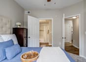 Thumbnail 7 of 33 - a bedroom with carpet floor and doors and ceiling fan