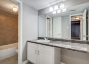 Thumbnail 8 of 29 - Westchase Apartments in Harvey LA photo of a bathroom with a sink and a mirror