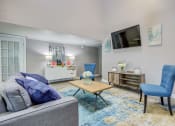 Thumbnail 27 of 29 - Westchase Apartments in Harvey LA photo of clubhouse seating with couch and tv