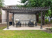 Thumbnail 24 of 39 - Pet-Friendly Apartments in Houston, TX – Westchase Forest – Photo of BBQ Grill and Picnic Tables