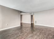 Thumbnail 12 of 33 - Whitney Manor Apartments in Gretna, LA photo of living room with hardwood flooring