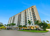 Thumbnail 21 of 22 - High-rise apartment building exterior at Wilton Tower in Wilton Manors, Florida.