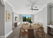 Thumbnail 7 of 22 - Dining area and open living space inside a renovated apartment at Wilton Tower in Wilton Manors, FL.

15. shooootin-photo-15_final
