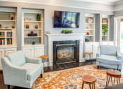 Thumbnail 27 of 48 - clubhouse lounge area with fireplace