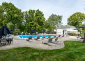 Thumbnail 29 of 48 - pool area with sun deck and lounge chairs