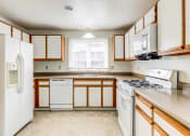Thumbnail 23 of 48 - large kitchen with white appliances