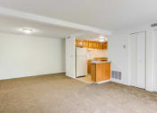 Thumbnail 14 of 48 - living room and kitchen with white appliances