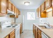 Thumbnail 16 of 48 - galley style kitchen with white appliances