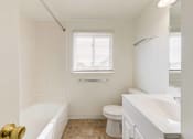 Thumbnail 22 of 48 - bathroom with tub and white vanity