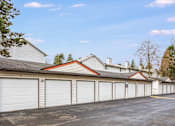 Thumbnail 30 of 35 - A row of garage doors in front of a building.