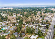 Thumbnail 31 of 35 - A suburban area with a road running through it.