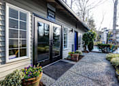 Thumbnail 10 of 35 - a view of the front of the building with a ramp leading up to the door